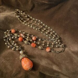 Vintage two strand necklace with salmon beads and pendant gold tone